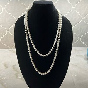 White Costume Pearl Necklace. 28 inches when doubled.  Nice Piece.